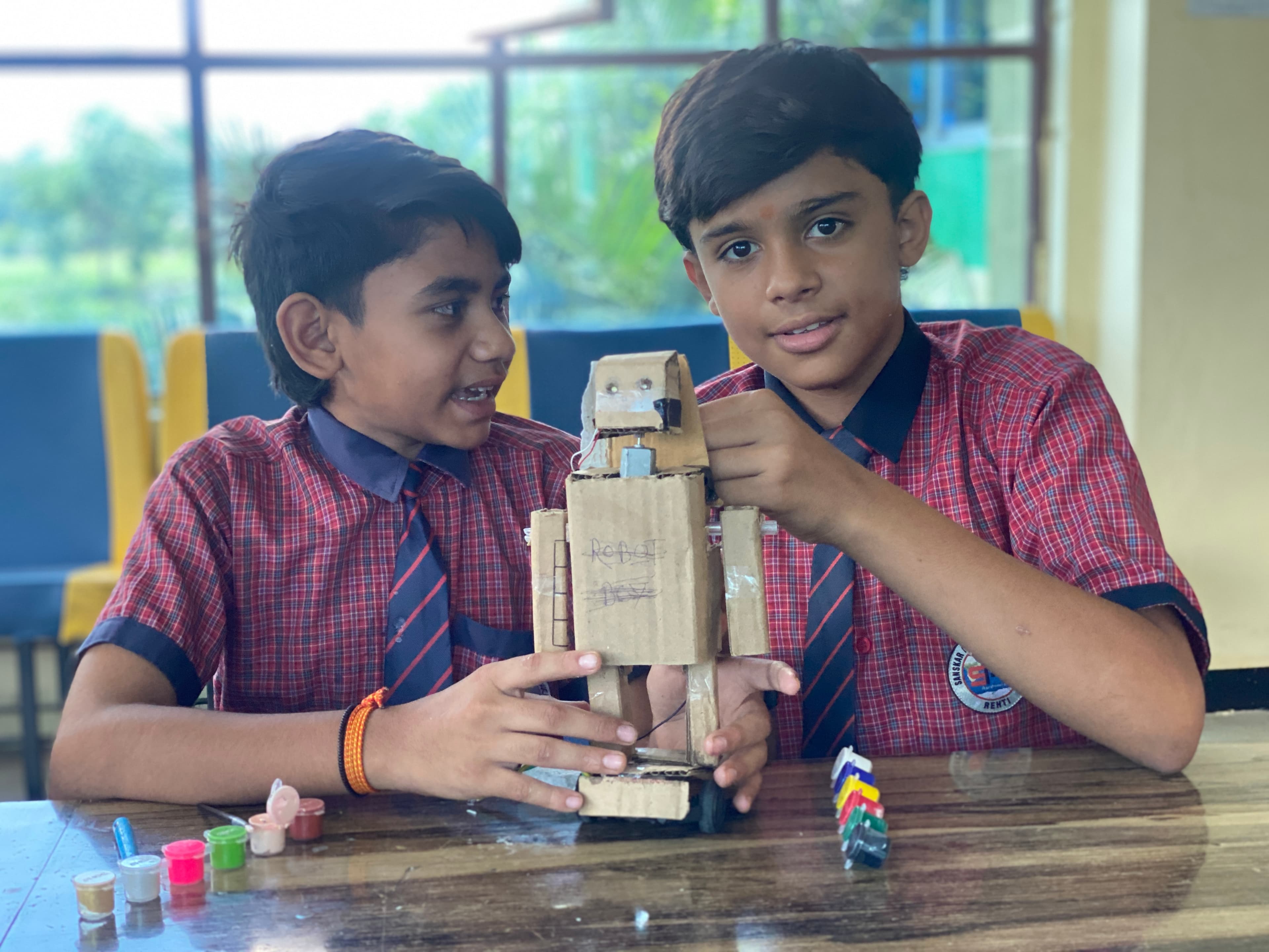 Sanskar Academy students presenting a creative model